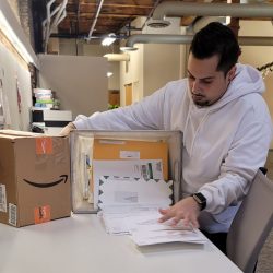 An employee of New York Registered Agent sorts mail in the Albany office.