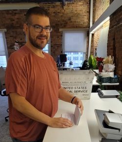 An employee of New York Registered Agent LLC sorts mail in the Albany office.